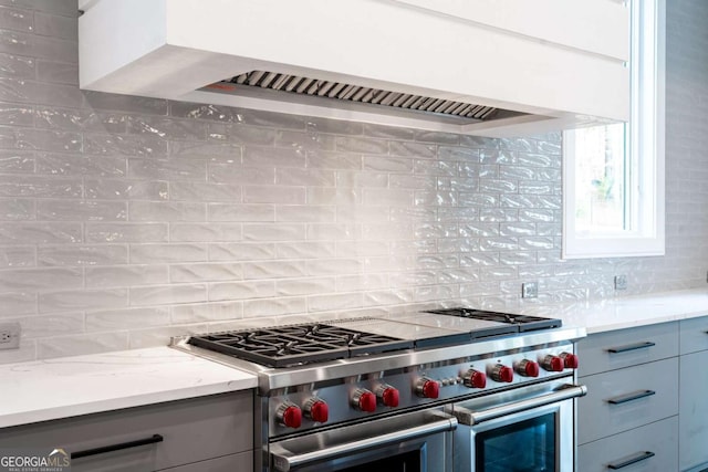 5211 Powers Ferry Rd, Sandy Springs, GA 30327 - kitchen featuring range with two ovens, custom range hood, decorative backsplash, and gray cabinets