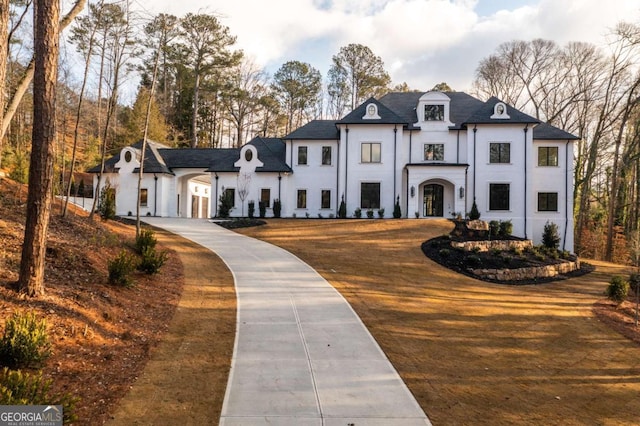 5211 Powers Ferry Rd, Sandy Springs, GA 30327 - french country style house with stucco siding and driveway