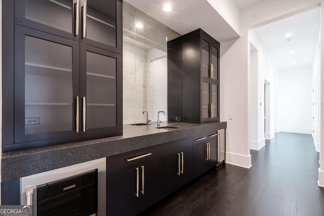 5211 Powers Ferry Rd, Sandy Springs, GA 30327 - bar with a sink, dark wood-type flooring, baseboards, and recessed lighting