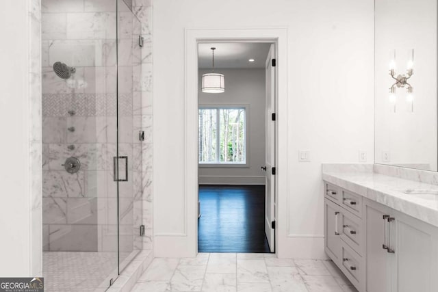 5211 Powers Ferry Rd, Sandy Springs, GA 30327 - bathroom featuring marble look tile flooring, a shower stall, vanity, and baseboards