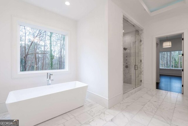 5211 Powers Ferry Rd, Sandy Springs, GA 30327 - bathroom featuring marble finish floors, a shower stall, baseboards, a freestanding bath, and recessed lighting
