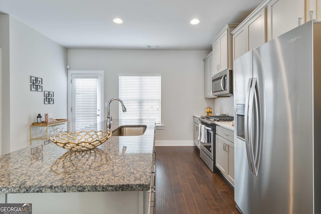 1405 Attwater Dr, Atlanta, GA 30316 - kitchen featuring appliances with stainless steel finishes, a sink, dark wood-style flooring, recessed lighting, and a kitchen island with sink