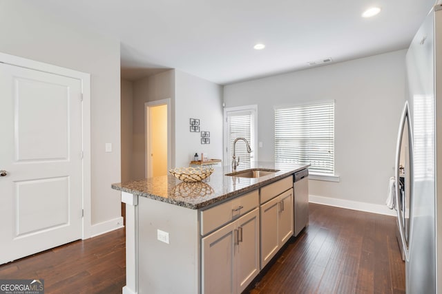 1405 Attwater Dr, Atlanta, GA 30316 - kitchen featuring a sink, appliances with stainless steel finishes, light stone counters, dark wood-style flooring, and recessed lighting