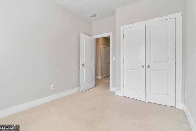 1405 Attwater Dr, Atlanta, GA 30316 - unfurnished bedroom with light carpet, baseboards, and a closet