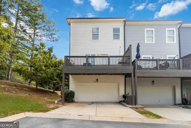 1405 Attwater Dr, Atlanta, GA 30316 - back of property featuring an attached garage, central AC, and driveway