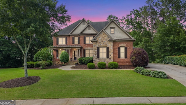 5925 Water Mark Dr, Cumming, GA 30040 - craftsman inspired home featuring a front yard, a porch, and brick siding