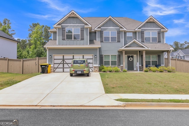 4320 Cornwall, Forsyth, GA 31029 - craftsman-style house featuring board and batten siding, an attached garage, driveway, stone siding, and a shingled roof