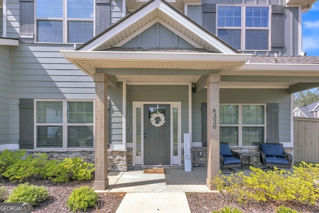 4320 Cornwall, Forsyth, GA 31029 - property entrance with covered porch, board and batten siding, and stone siding