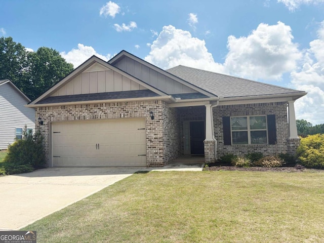 craftsman house with brick siding, a garage, board and batten siding, a front lawn, and concrete driveway