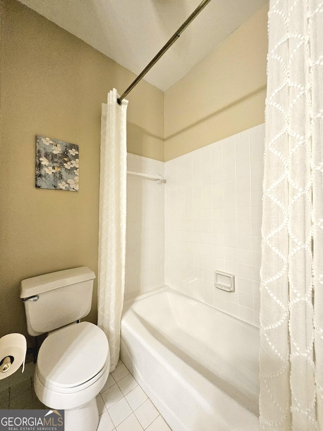 full bathroom featuring tile patterned flooring, toilet, and shower / bath combo