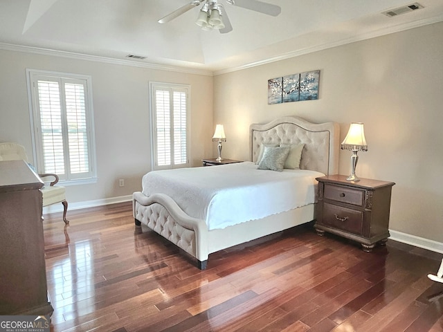 bedroom featuring dark wood-style flooring, crown molding, baseboards, and ceiling fan