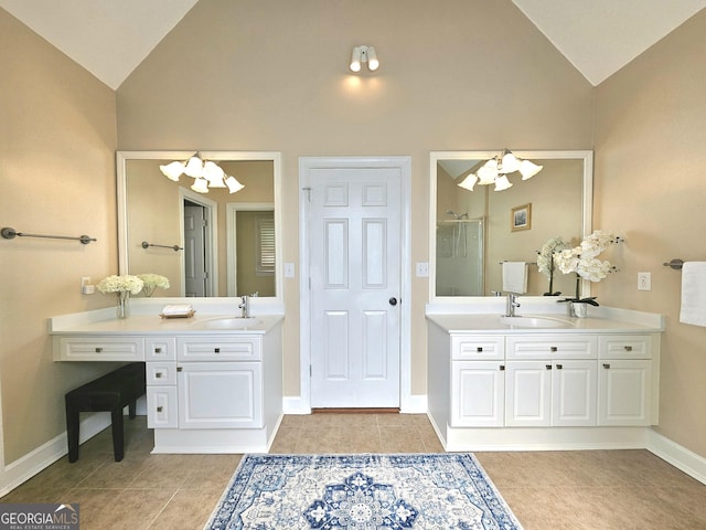 bathroom with a chandelier, tile patterned flooring, a shower stall, two vanities, and high vaulted ceiling