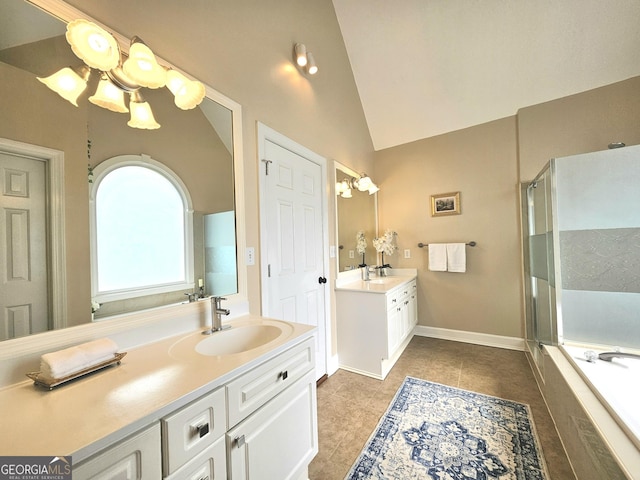 bathroom featuring a stall shower, lofted ceiling, two vanities, tile patterned floors, and a tub to relax in