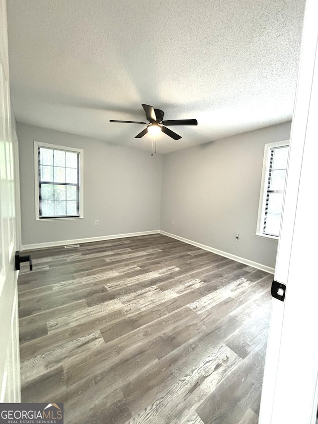4516 Bon Ayer Cir, Macon, GA 31204 - spare room featuring ceiling fan, a textured ceiling, baseboards, and wood finished floors