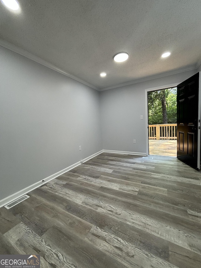 4516 Bon Ayer Cir, Macon, GA 31204 - spare room featuring ornamental molding, a textured ceiling, recessed lighting, wood finished floors, and baseboards