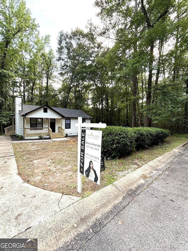 4516 Bon Ayer Cir, Macon, GA 31204 - view of front of house with covered porch and view of wooded area