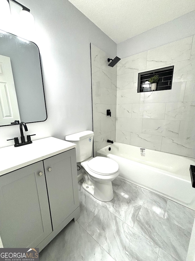 4516 Bon Ayer Cir, Macon, GA 31204 - full bath featuring toilet, vanity, marble finish flooring, shower / bathtub combination, and a textured ceiling