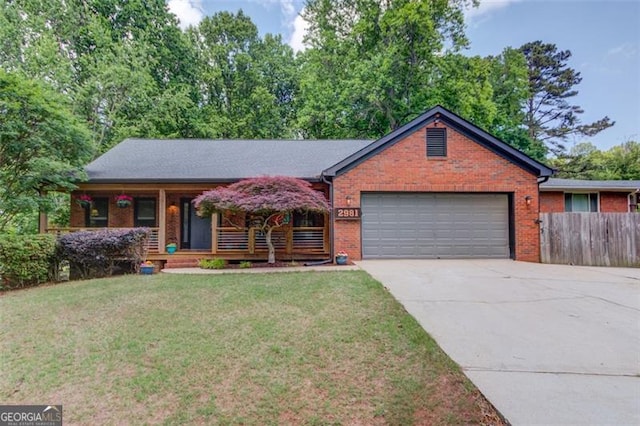 view of front of property with a garage, brick siding, driveway, and a porch