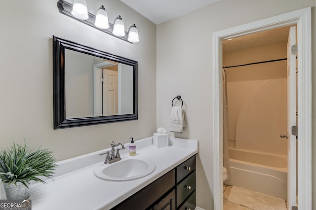 bathroom featuring toilet, vanity, shower / bath combination, and tile patterned flooring