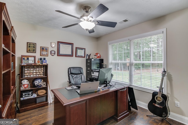 office space with baseboards, dark wood-style floors, and ceiling fan