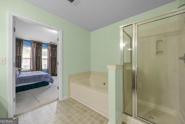 2656 Avanti Way, Decatur, GA 30035 - ensuite bathroom with a bath, a shower stall, and baseboards