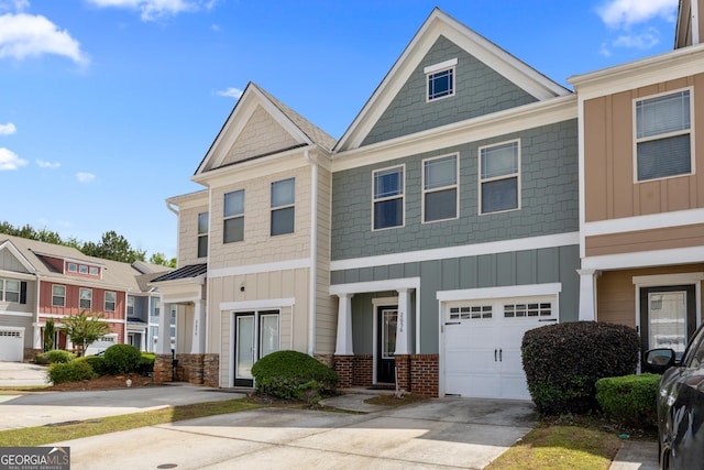 2656 Avanti Way, Decatur, GA 30035 - townhome / multi-family property with board and batten siding, concrete driveway, and an attached garage