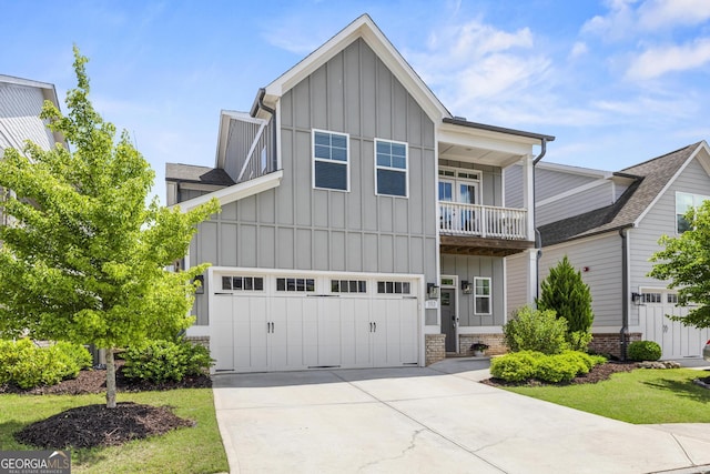 view of front of house with board and batten siding, driveway, and an attached garage
