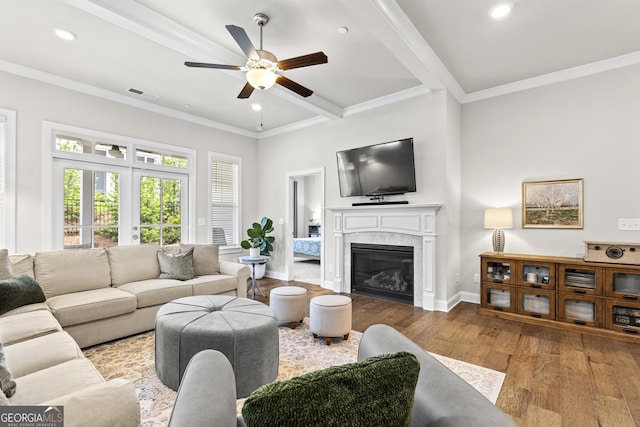 living room featuring wood finished floors, a ceiling fan, a premium fireplace, baseboards, and recessed lighting