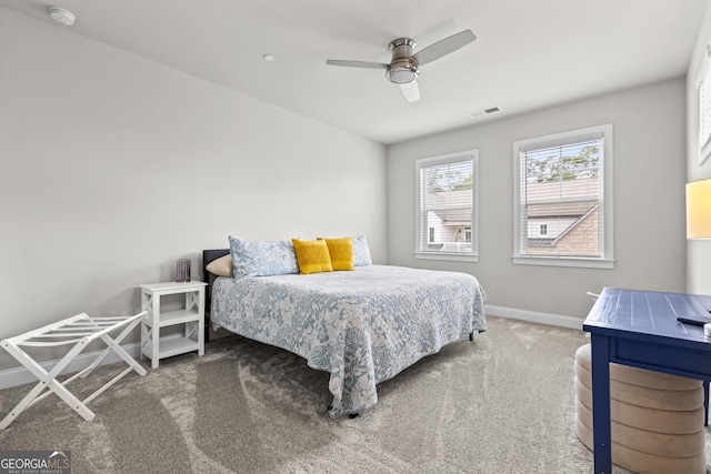 bedroom with carpet, baseboards, and a ceiling fan