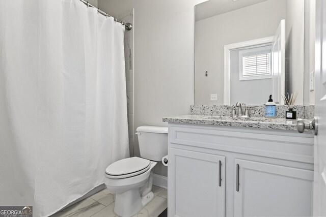 full bathroom with toilet, vanity, marble look tiles, baseboards, and a shower with curtain