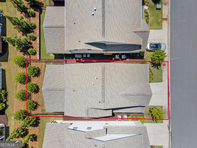 aerial view of property and surrounding area featuring property boundaries highlighted