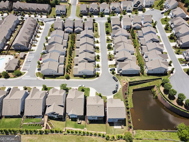 aerial perspective of suburban area featuring a nearby body of water
