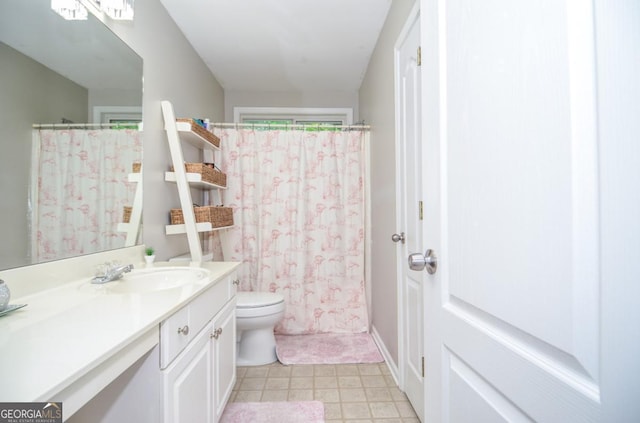 full bathroom featuring toilet, vanity, and a shower with shower curtain