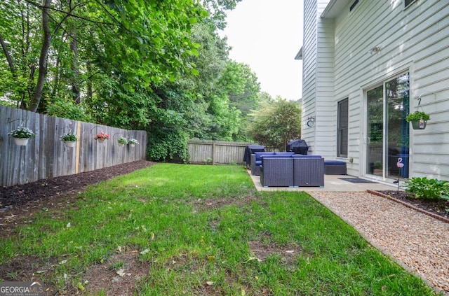 view of yard with outdoor lounge area and a patio