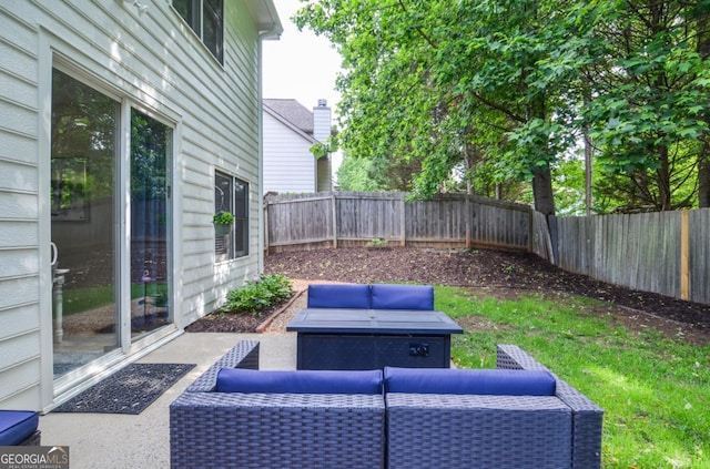 view of patio with a fenced backyard and an outdoor living space