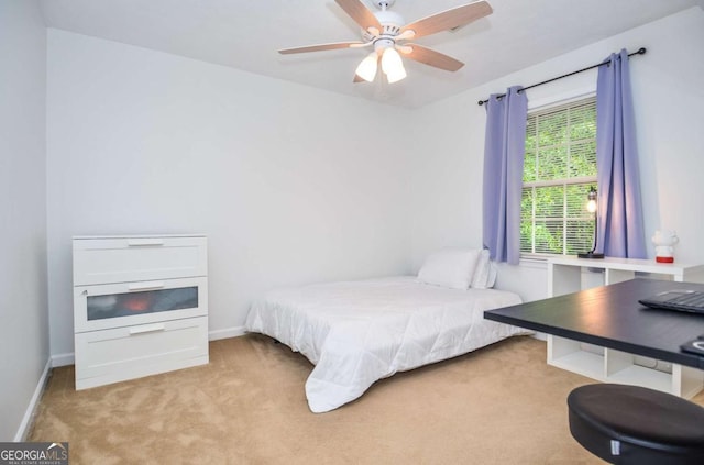bedroom with carpet flooring, baseboards, and ceiling fan