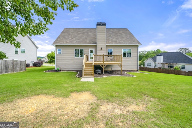 rear view of property featuring a wooden deck, a chimney, stairway, and a shingled roof