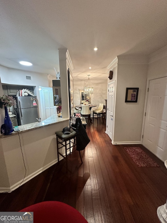 200 Renaissance Pkwy Unit 305, Atlanta, GA 30308 - hall with a chandelier, dark wood-type flooring, baseboards, recessed lighting, and crown molding