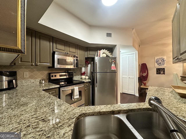 200 Renaissance Pkwy Unit 305, Atlanta, GA 30308 - kitchen with stainless steel appliances, a sink, light stone counters, and tasteful backsplash