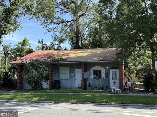 1110 Carswell Ave, Waycross, GA 31503 - view of front of house with a metal roof and covered porch