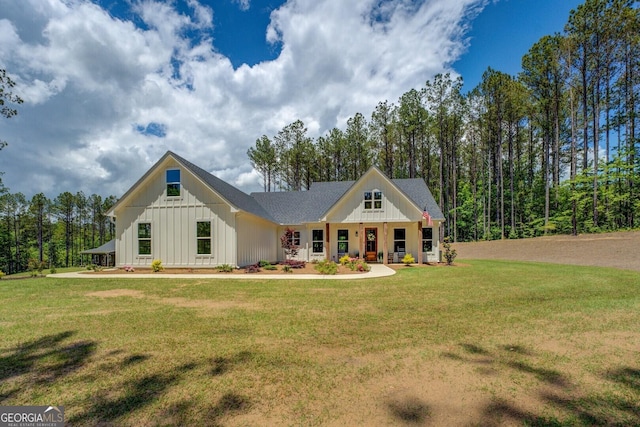 modern farmhouse with board and batten siding and a front yard