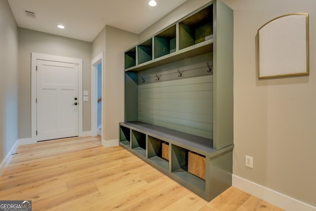 mudroom with baseboards, wood finished floors, and recessed lighting