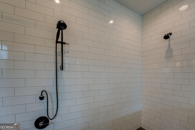 bathroom with tiled shower