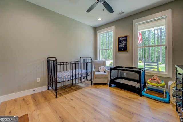 bedroom with hardwood / wood-style flooring, baseboards, recessed lighting, and ceiling fan