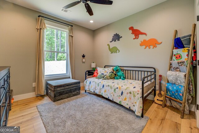 bedroom featuring light wood-style floors, baseboards, recessed lighting, and a ceiling fan