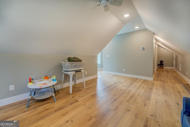additional living space featuring light wood-style floors, ceiling fan, lofted ceiling, recessed lighting, and baseboards