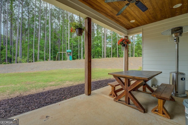 view of patio / terrace with a ceiling fan, outdoor dining area, and a playground