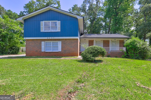 4593 Bexley Way, Stone Mountain, GA 30083 - tri-level home featuring brick siding, a front yard, and covered porch