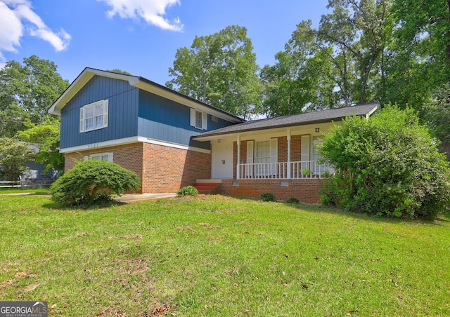 4593 Bexley Way, Stone Mountain, GA 30083 - split level home with brick siding, covered porch, and a front yard