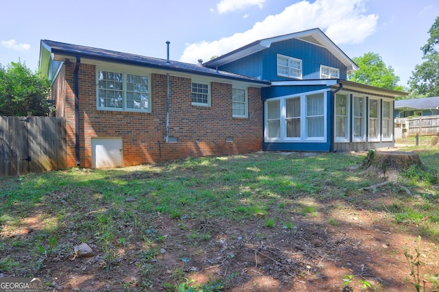 4593 Bexley Way, Stone Mountain, GA 30083 - back of house with brick siding and a sunroom